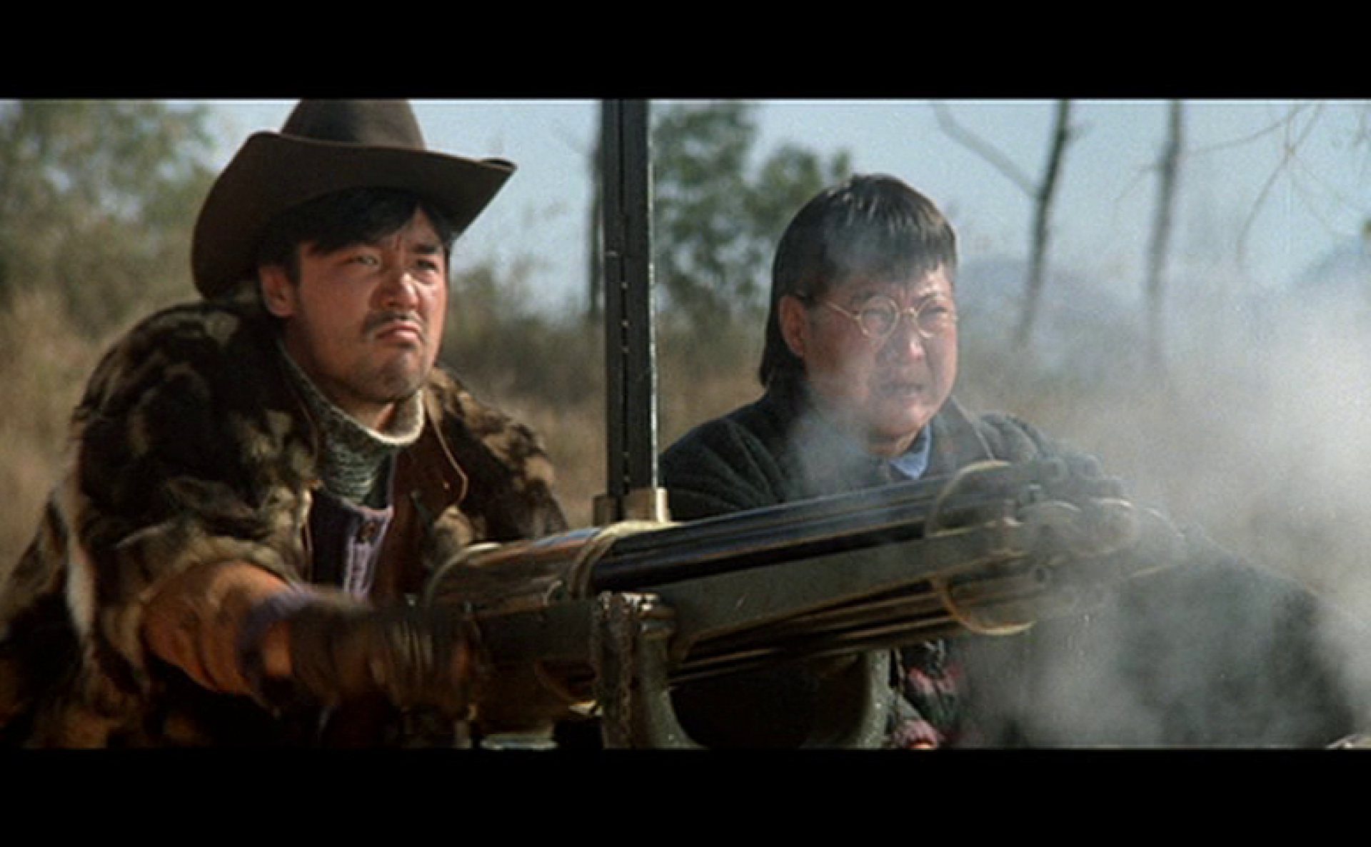 Chinese cowboys shooting old machine gun,